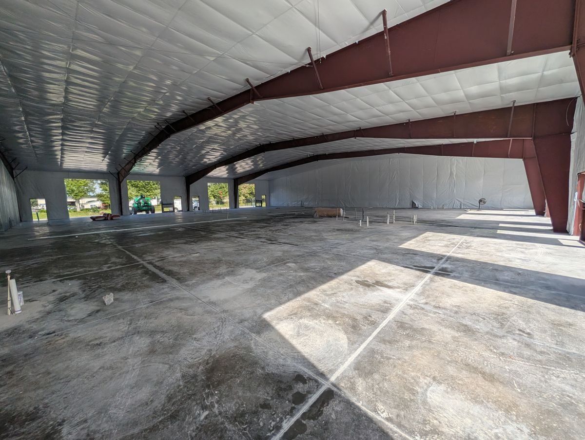 Interior of a steel-frame flex building with an open clear-span floor.